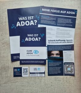 Flatlay Deutsche downloads Cure ADOA Foundation